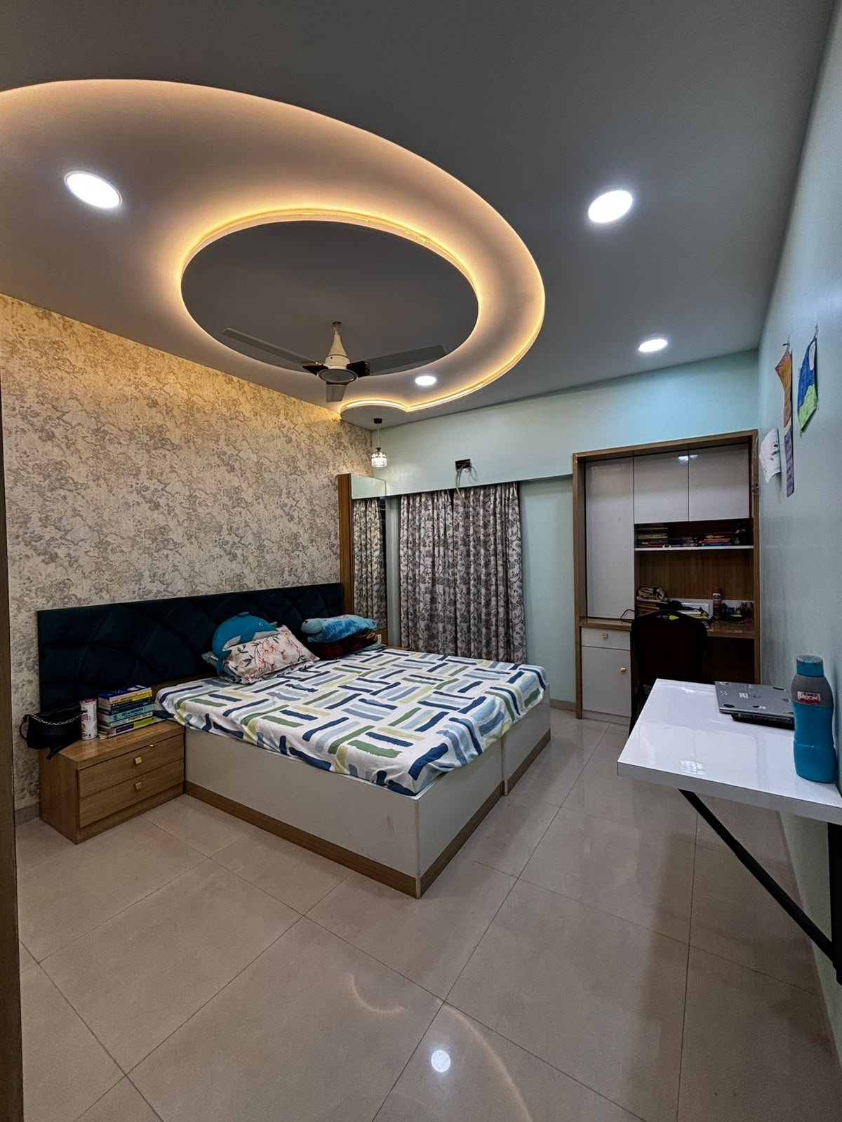 Kids bedroom with a comfortable bed and coordinated interior finishes