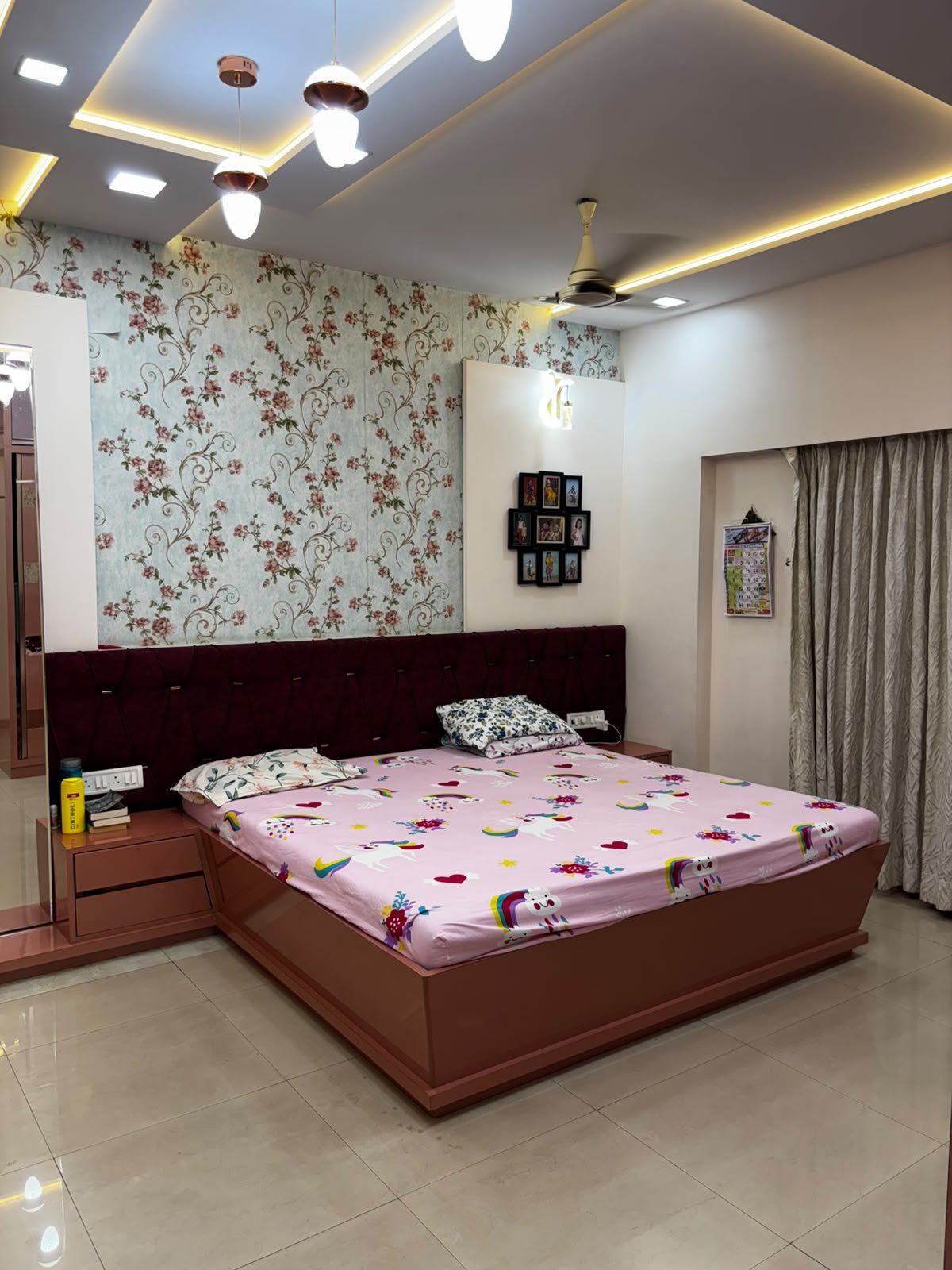 Master bedroom with a softly lit ceiling and coordinated furniture