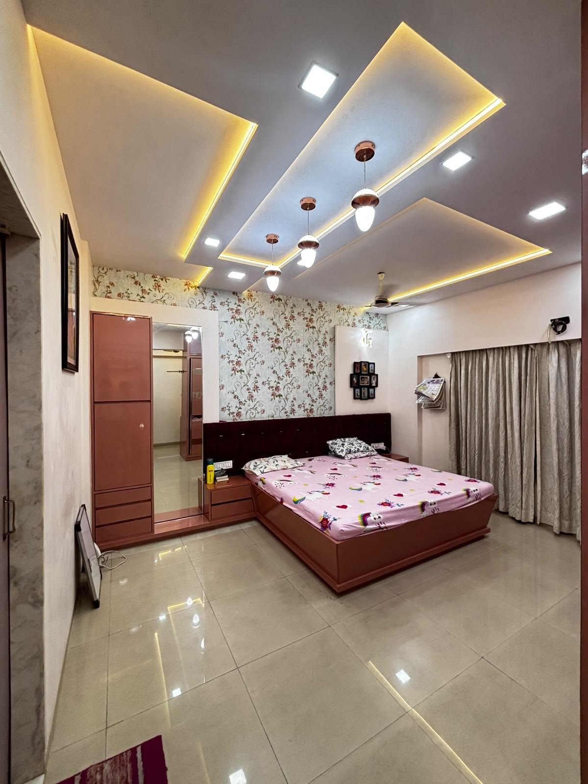 Master bedroom with a feature headboard and ambient lighting