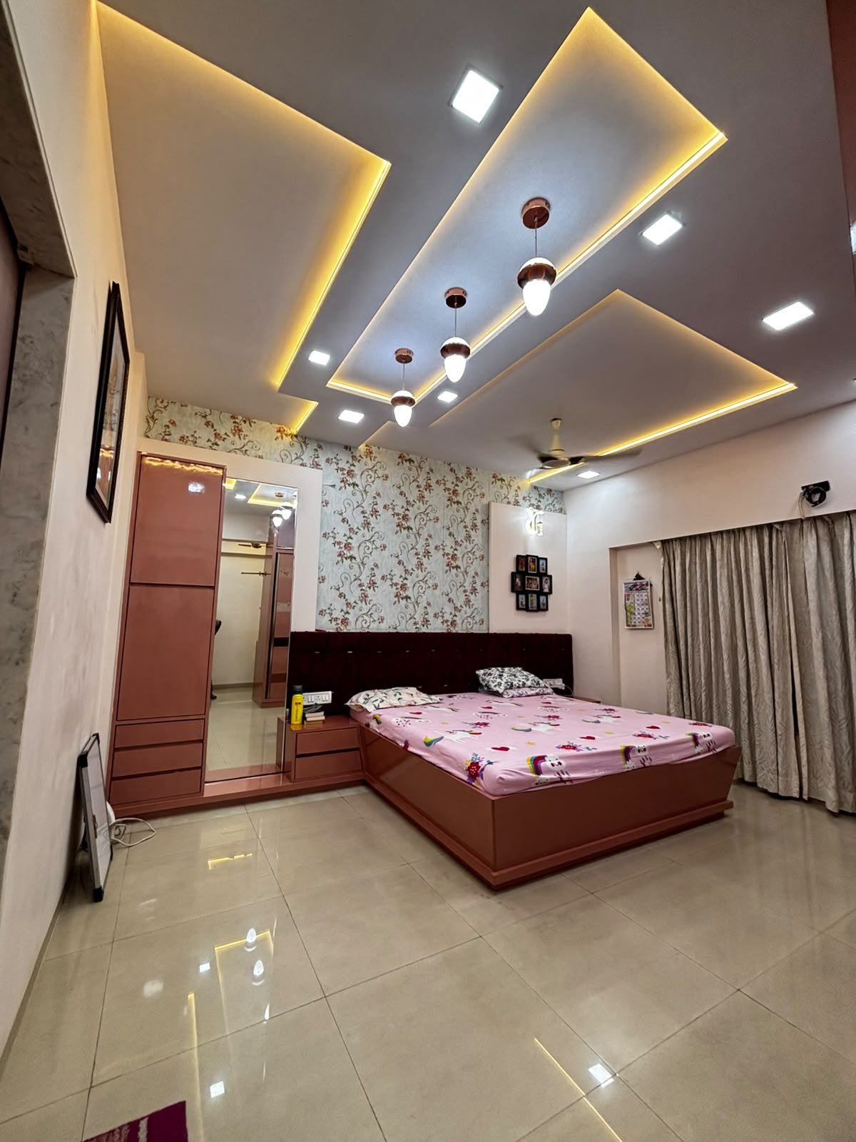 Master bedroom with a statement ceiling and custom interior finishes