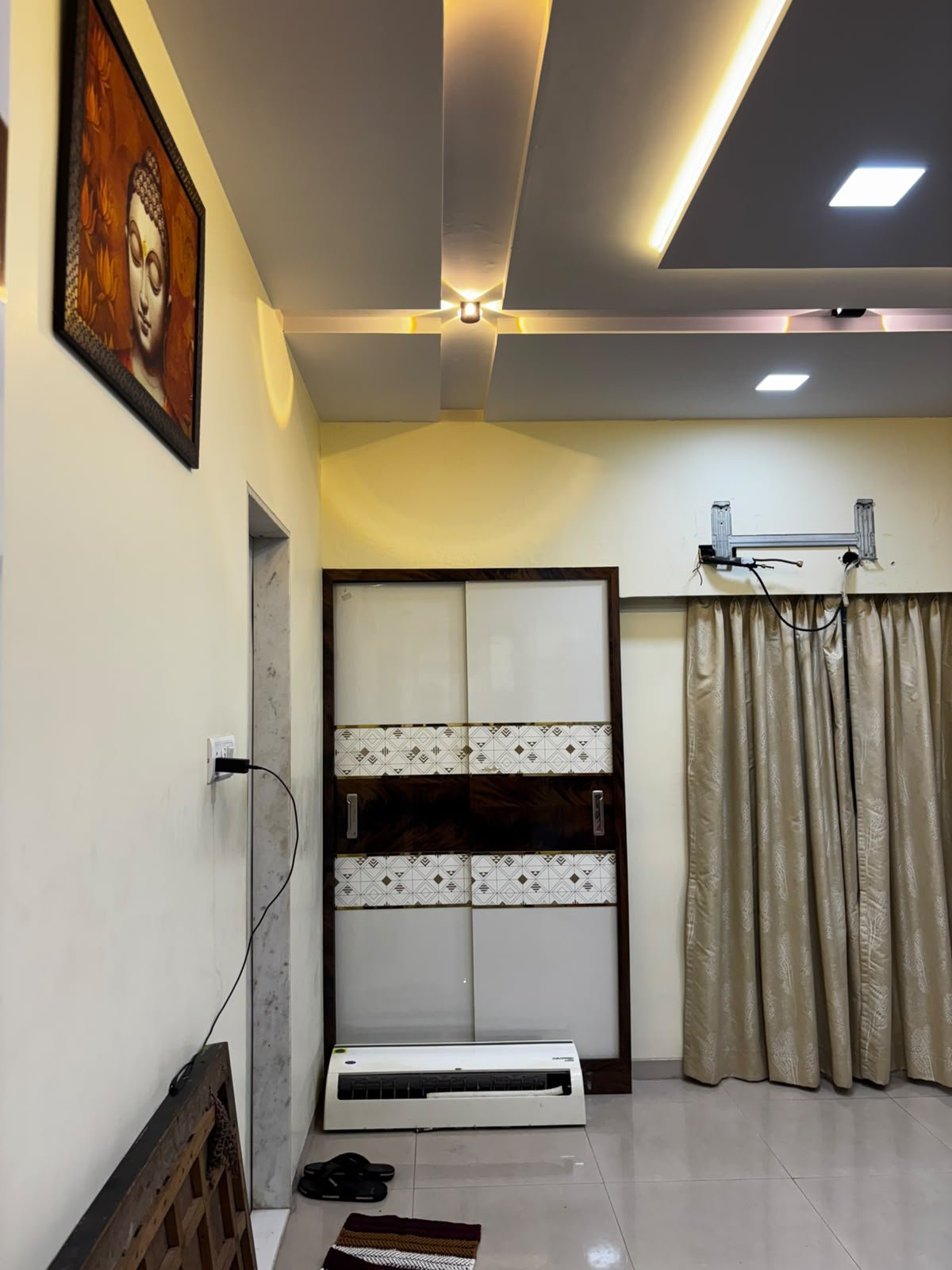 Parent bedroom with a layered ceiling and warm accent lighting