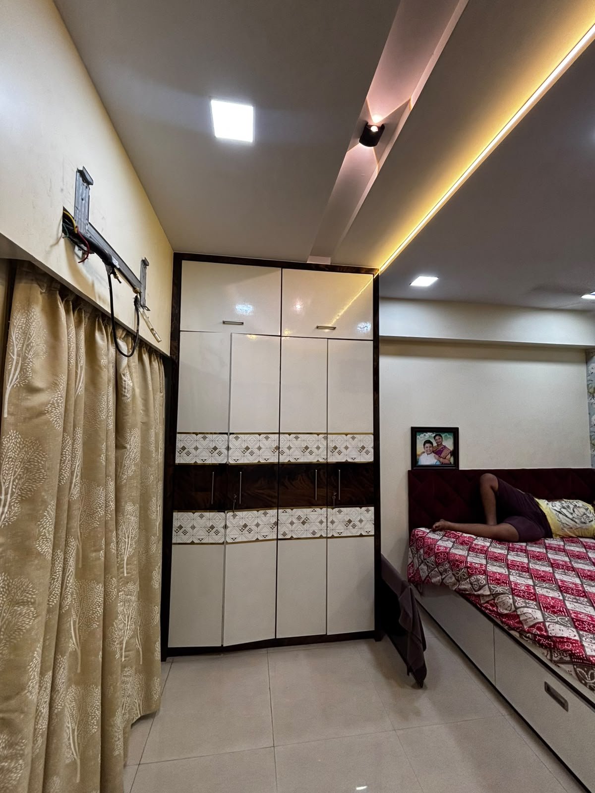 Parent bedroom wardrobe and bed with coordinated finishes