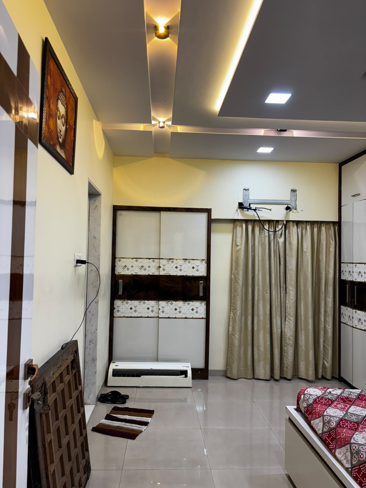 Custom wardrobe beside the parent bedroom bed